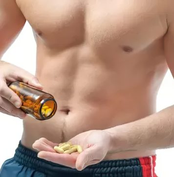 Person holding a bottle of diet pills