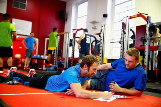 Two Men on the Mat in the Gym