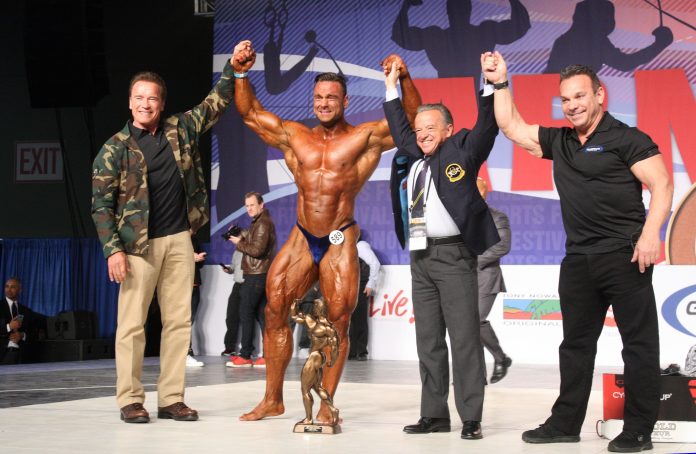 Men’s Bodybuilding Overall Winner Paul Poloczek of Germany, Left to Right Gov. Arnold Schwarzenegger, Poloczek, Dr. Rafael Santonja, Rich Gaspari