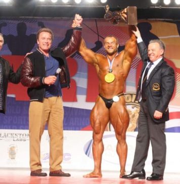 Mens Bodybuilding Overall Winner left to right Jim Manion Arnold Schwarzenegger Sergey Kulaev of Russia Dr Rafael Santonja