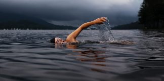 Can Swimming Help You Lose Weight? Man swimming on lake