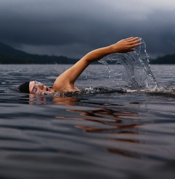 Man swimming on lake